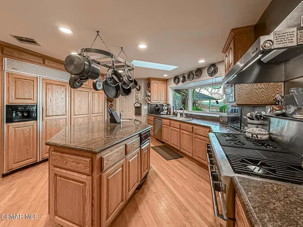 a living room with furniture a rug and a window