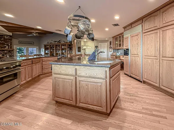 a spacious bedroom with a large bed and a large window