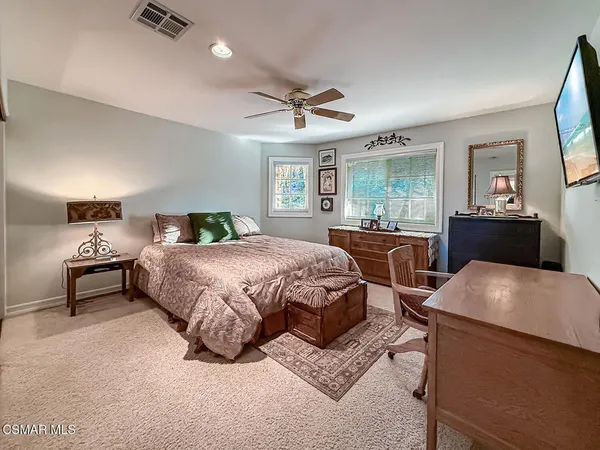 a view of a backyard with large trees