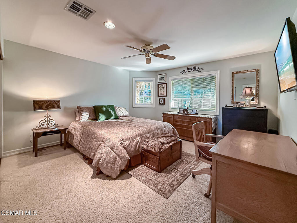 24525 Desert Avenue Newhall, CA 91321 - Photo 41 of 76 a bedroom with a bed and window