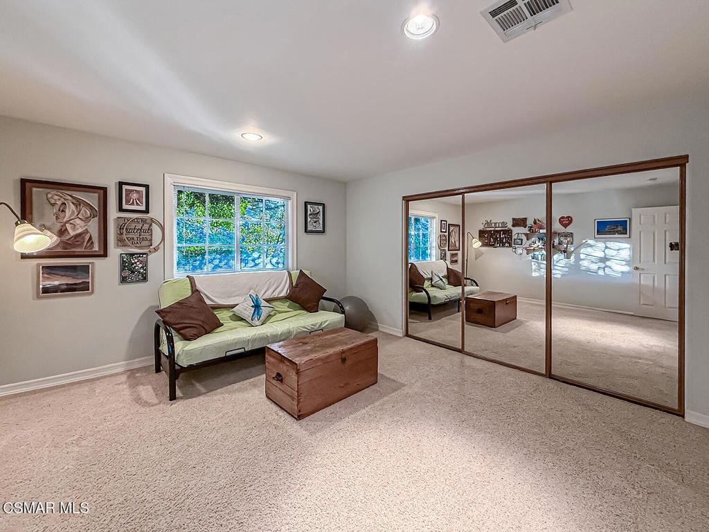 24525 Desert Avenue Newhall, CA 91321 - Photo 44 of 76 a living room with furniture and a chandelier