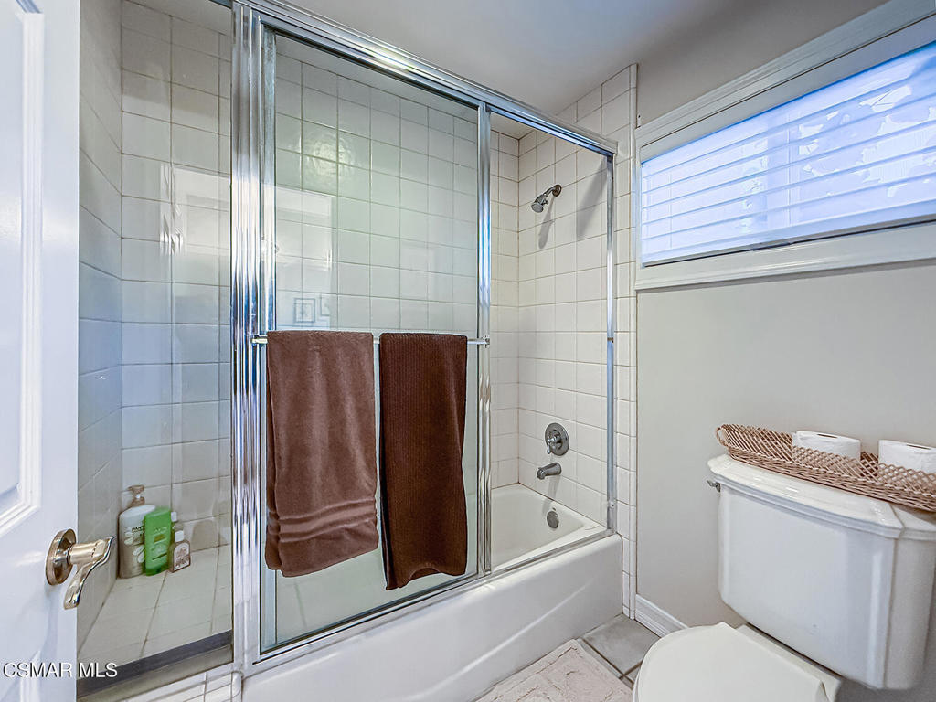 24525 Desert Avenue Newhall, CA 91321 - Photo 46 of 76 a bathroom with a shower and a toilet