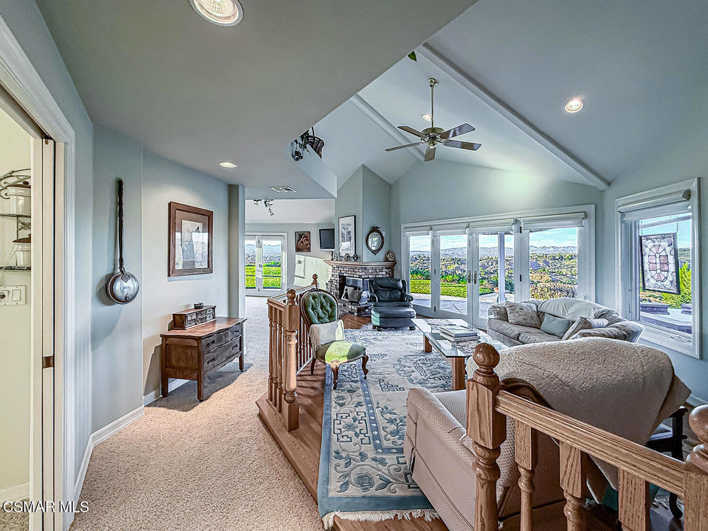 24525 Desert Avenue Newhall, CA 91321 - Photo 49 of 76 a living room with furniture ceiling fan and a window