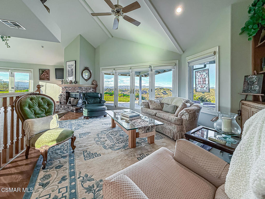 24525 Desert Avenue Newhall, CA 91321 - Photo 51 of 76 a living room with furniture kitchen view and a large window