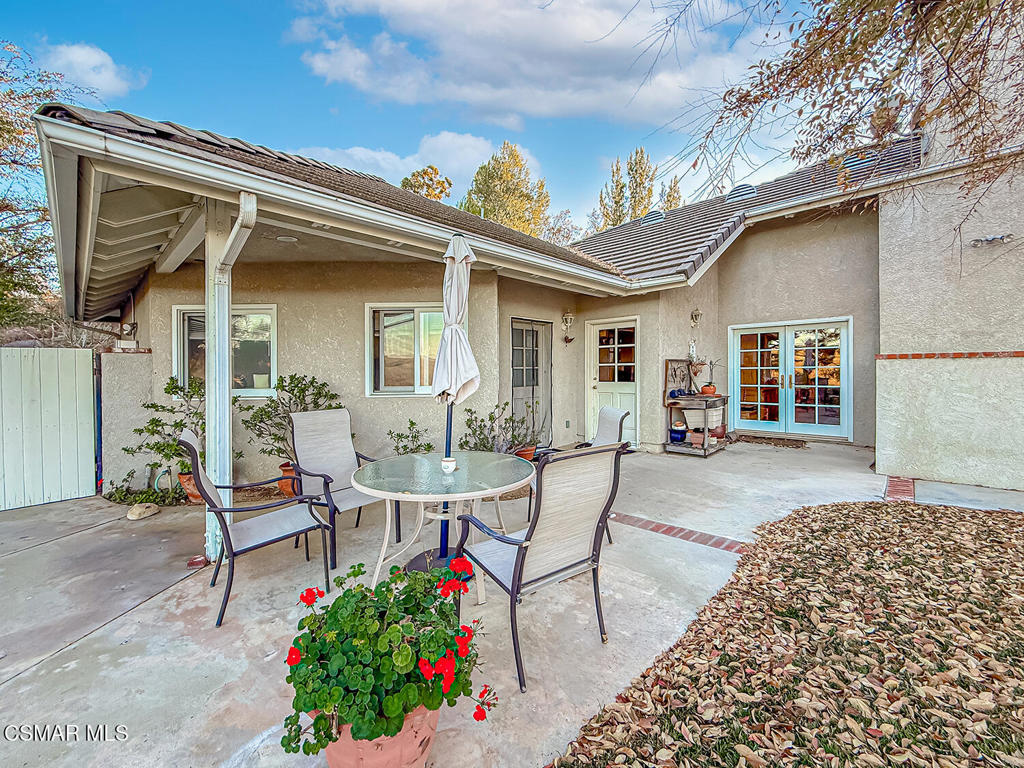 24525 Desert Avenue Newhall, CA 91321 - Photo 61 of 76 a view of a house with backyard and sitting area