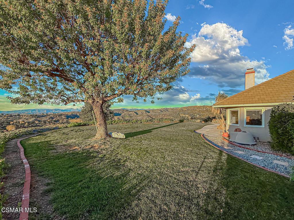 24525 Desert Avenue Newhall, CA 91321 - Photo 69 of 76 a view of a house with a yard