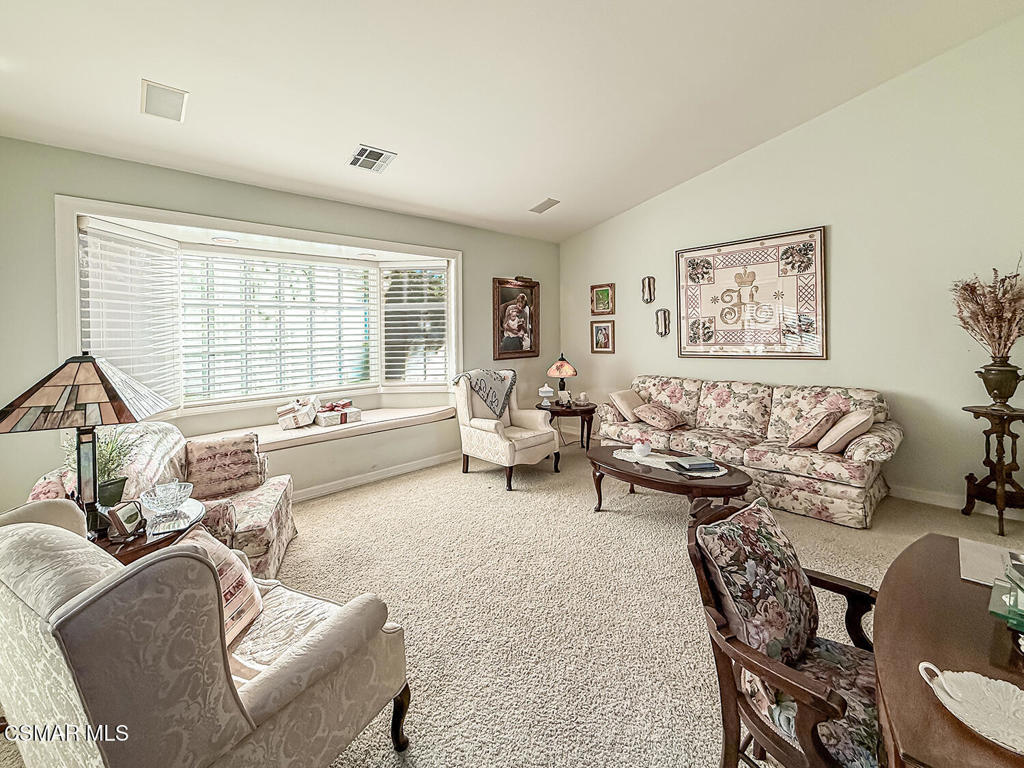 24525 Desert Avenue Newhall, CA 91321 - Photo 8 of 76 a living room with furniture and a large window