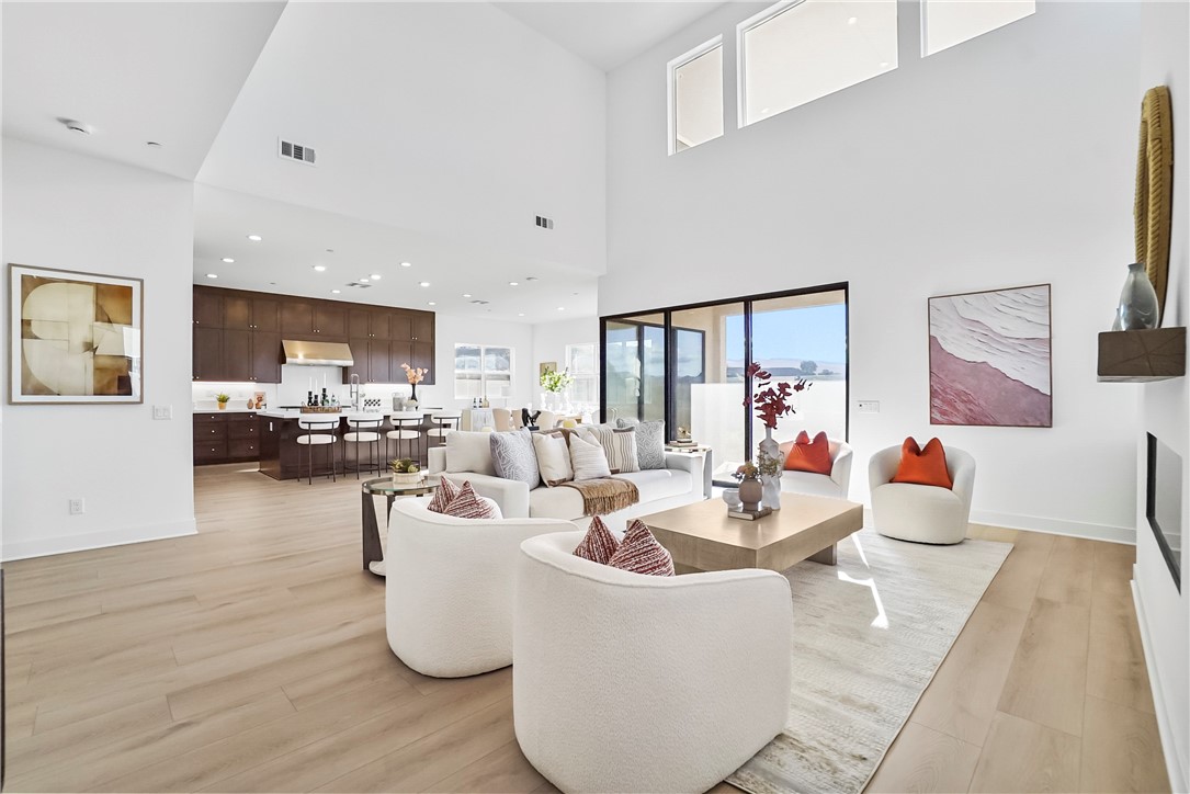 27392 Dialogue Way Valencia, CA 91381 - Photo 17 of 62 a living room with furniture and a wooden floor