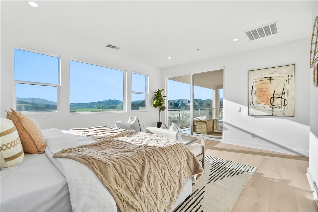 27392 Dialogue Way Valencia, CA 91381 - Photo 28 of 62 a bed sitting in a bedroom next to a window