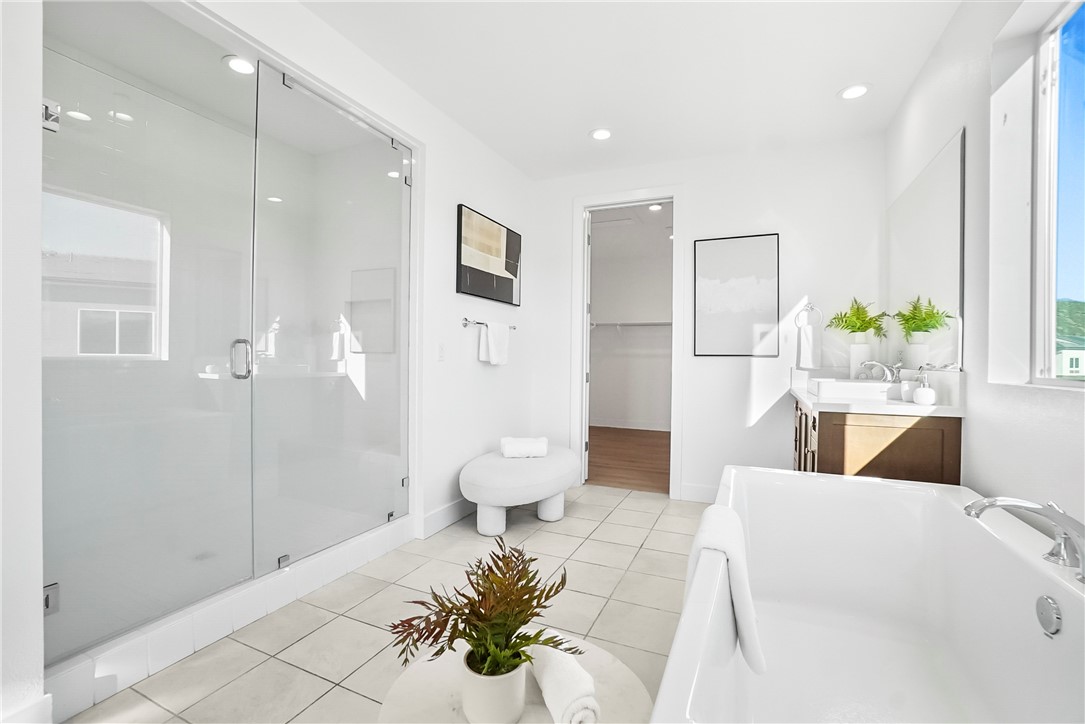 27392 Dialogue Way Valencia, CA 91381 - Photo 29 of 62 a large white room with a potted plant