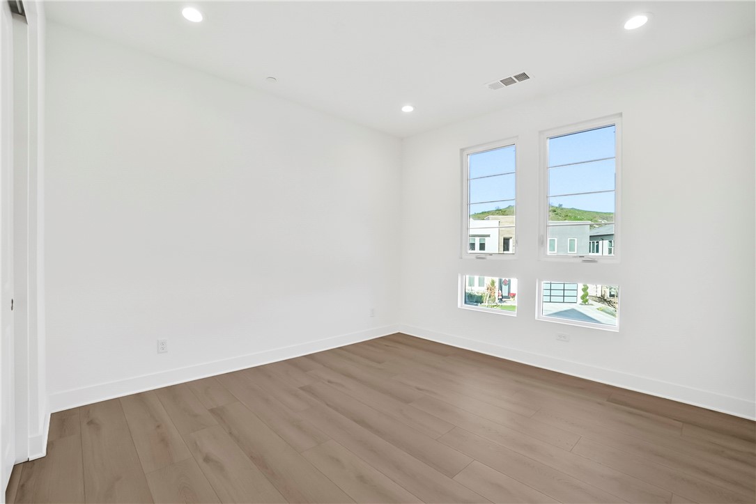 27392 Dialogue Way Valencia, CA 91381 - Photo 30 of 62 a view of an empty room with a window