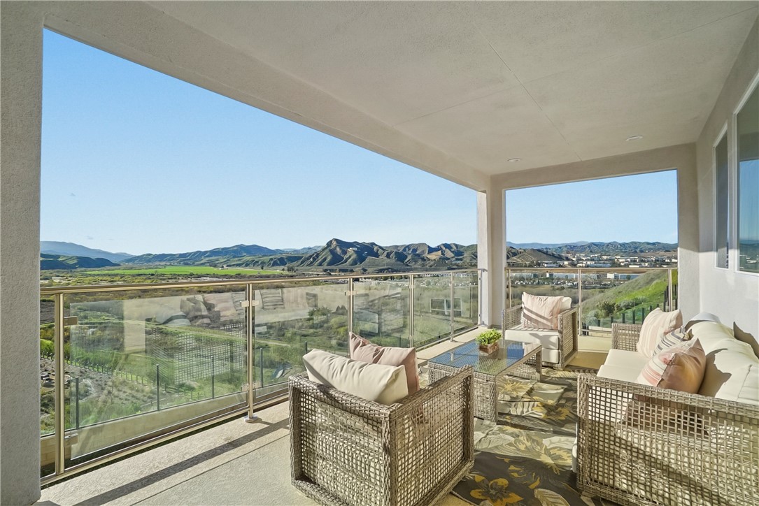 27392 Dialogue Way Valencia, CA 91381 - Photo 32 of 62 a view of a lake with couches in the patio