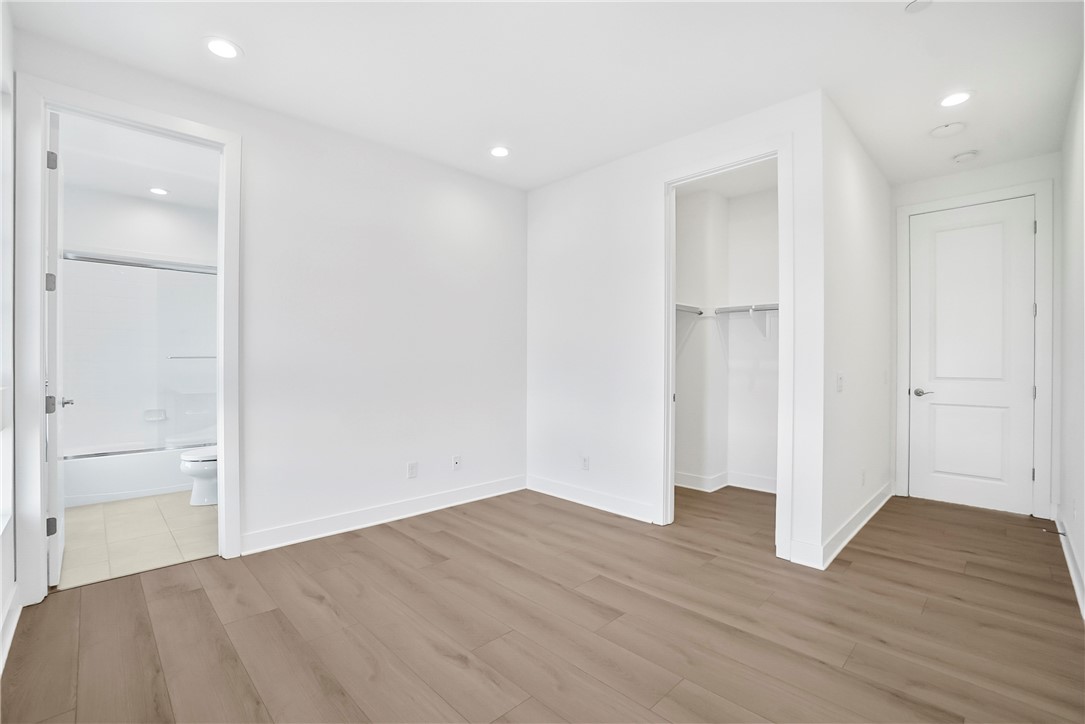 27392 Dialogue Way Valencia, CA 91381 - Photo 41 of 62 a view of empty room with wooden floor