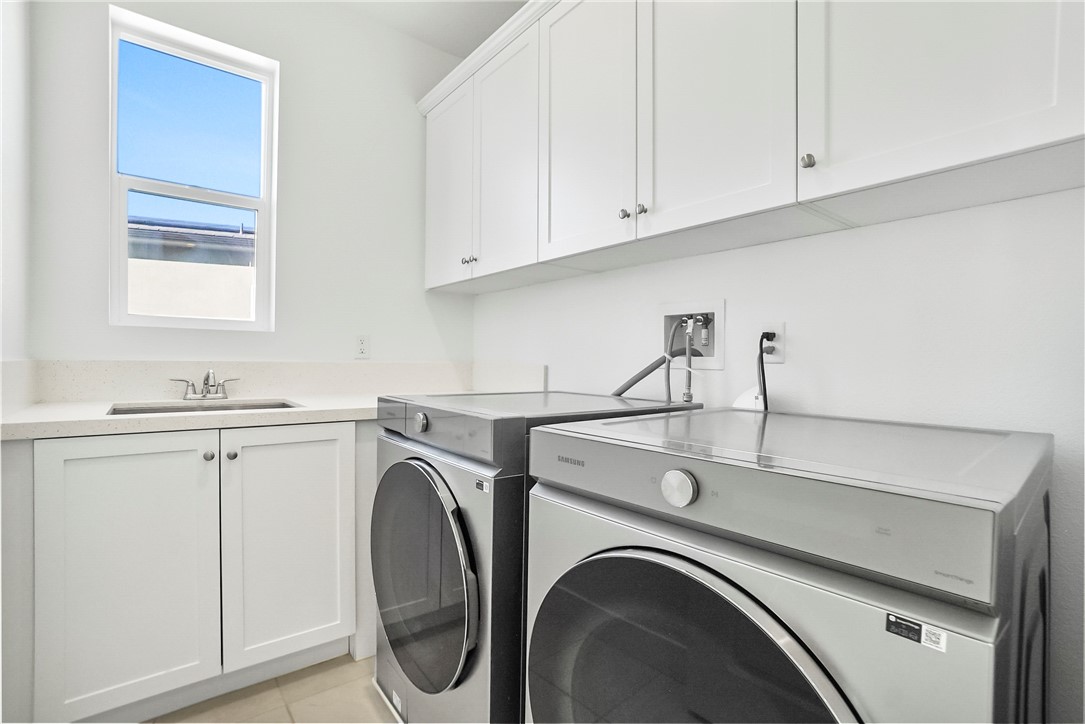 27392 Dialogue Way Valencia, CA 91381 - Photo 43 of 62 a utility room with dryer and washer