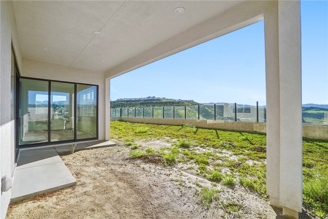 27392 Dialogue Way Valencia, CA 91381 - Photo 45 of 62 a view of an empty room with a window
