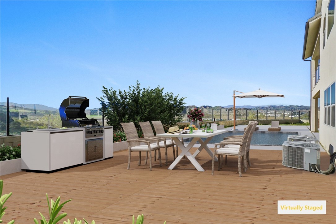 27392 Dialogue Way Valencia, CA 91381 - Photo 47 of 62 a view of a terrace with furniture and outdoor kitchen