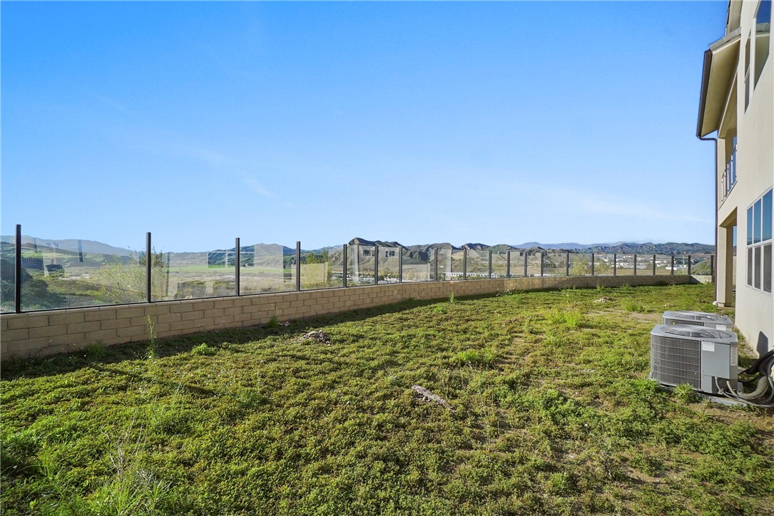 27392 Dialogue Way Valencia, CA 91381 - Photo 48 of 62 a view of a garden with an outdoor seating