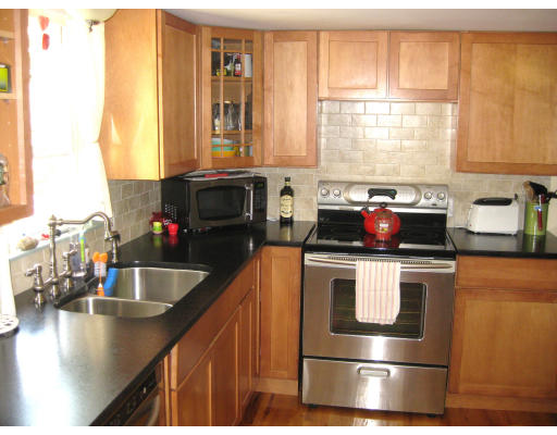 22 Ramshorn Road Dudley, MA 01571 - Photo 1 of 1 a kitchen with a stove a sink and a window
