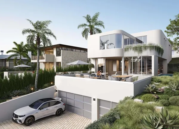 a view of a patio with table and chairs potted plants