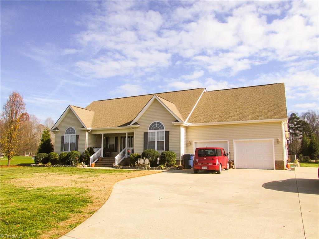 2791 Beckerdite Road Sophia, NC 27350 - Photo 1 of 25 A Big Rocking Chair Front Porch, Long Paved Crepe Myrtle Lined Drive, 2-Car Garage and No Maintenence Exterior Vinyl Siding.