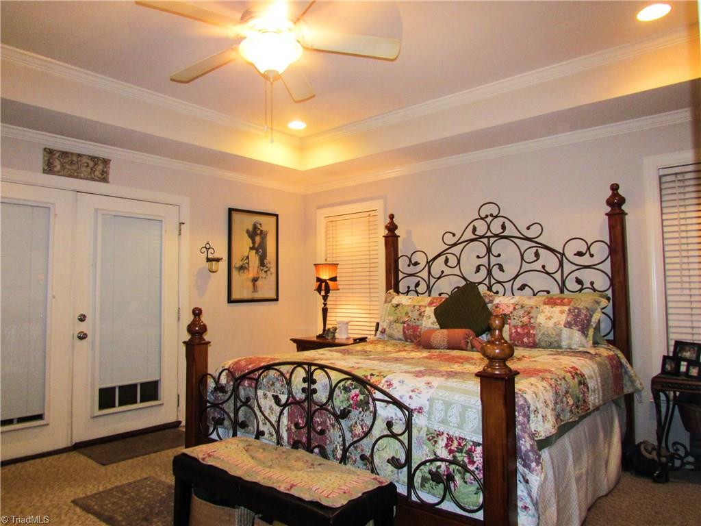 2791 Beckerdite Road Sophia, NC 27350 - Photo 17 of 25 Master Bedroom Features: A Trey Ceiling With Lighted Ceiling Fan, French Doors Escaping To The Deck/Backyard, Crown Moulding, Recessed Lighting, Berber Carpeting & Double Doors For Entry To The Master Bath.