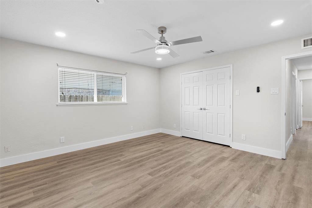 2008 East Peters Colony Road Carrollton, TX 75007 - Photo 17 of 35 wooden floor in an empty room with a window