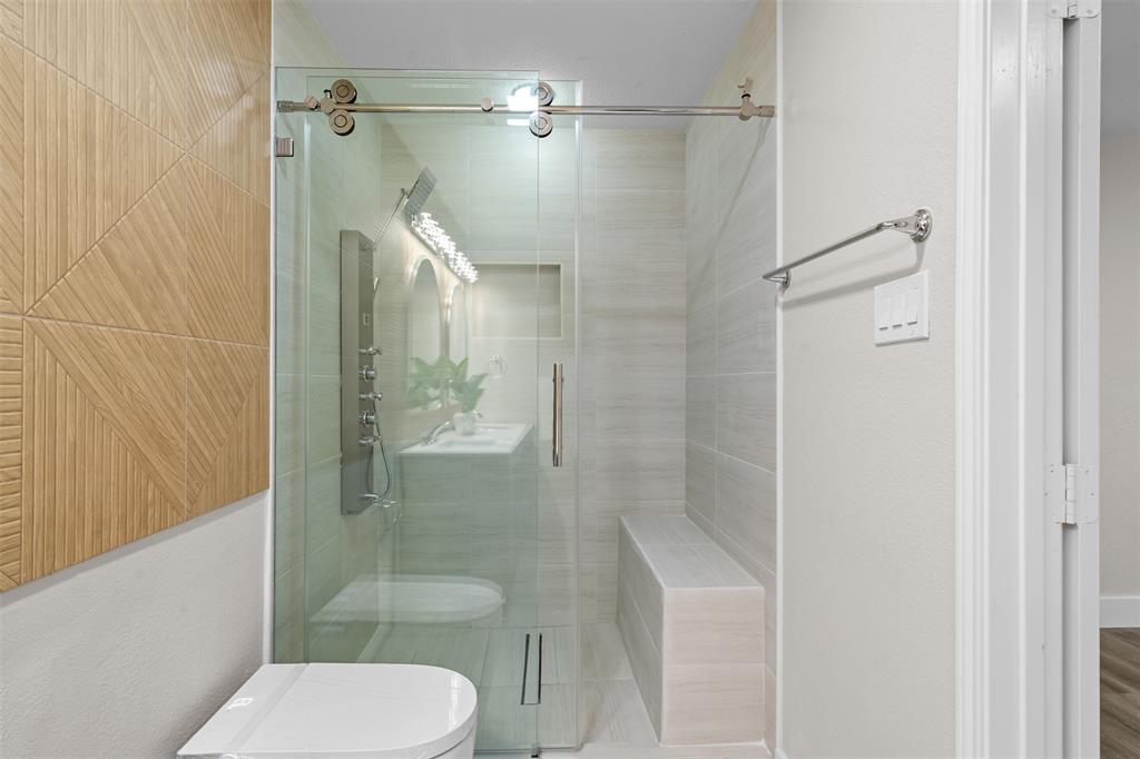 2008 East Peters Colony Road Carrollton, TX 75007 - Photo 21 of 35 a bathroom with a toilet and a shower