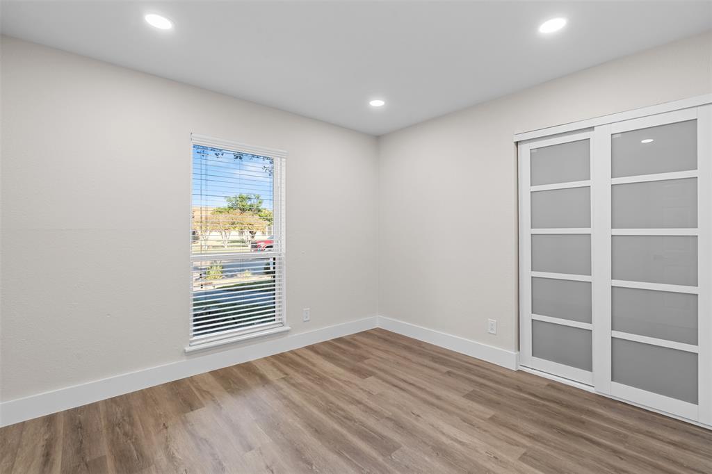 2008 East Peters Colony Road Carrollton, TX 75007 - Photo 28 of 35 a view of empty room with wooden floor and fan