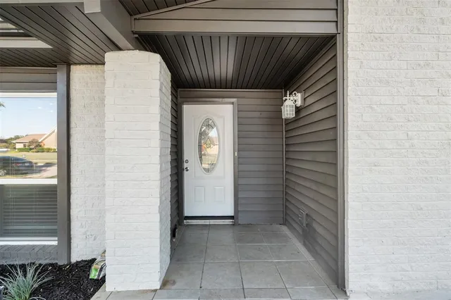 a view of a livingroom with wooden floor and a window