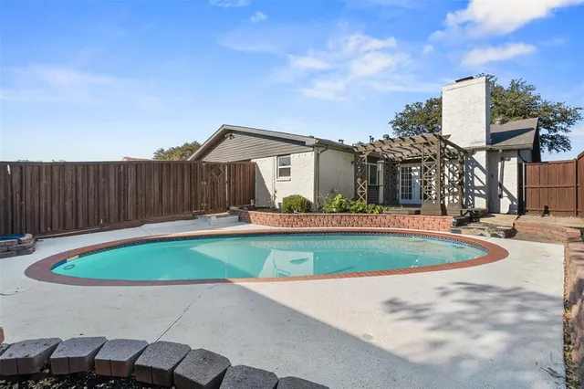 a view of a backyard with sitting area