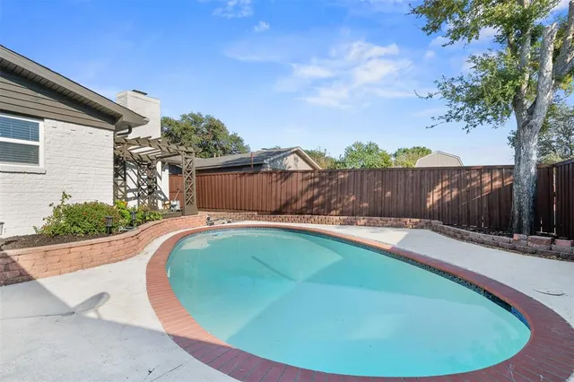 a picture of a bathroom with a shower