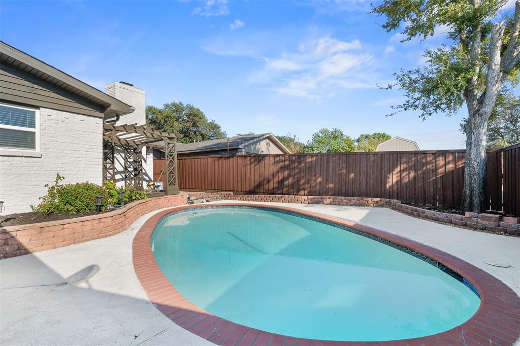 2008 East Peters Colony Road Carrollton, TX 75007 - Photo 34 of 35 a view of a swimming pool with a backyard