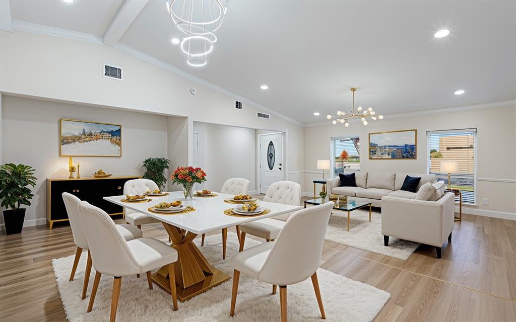 2008 East Peters Colony Road Carrollton, TX 75007 - Photo 7 of 35 a view of a dining room with furniture wooden floor and chandelier