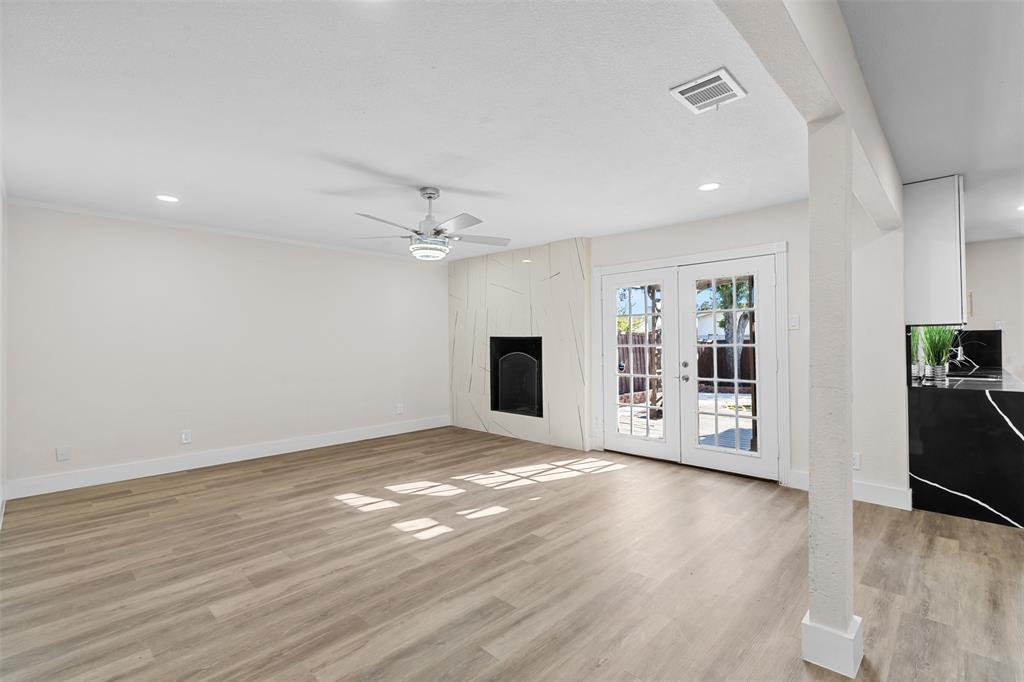 2008 East Peters Colony Road Carrollton, TX 75007 - Photo 8 of 35 a view of an empty room with a window and wooden floor