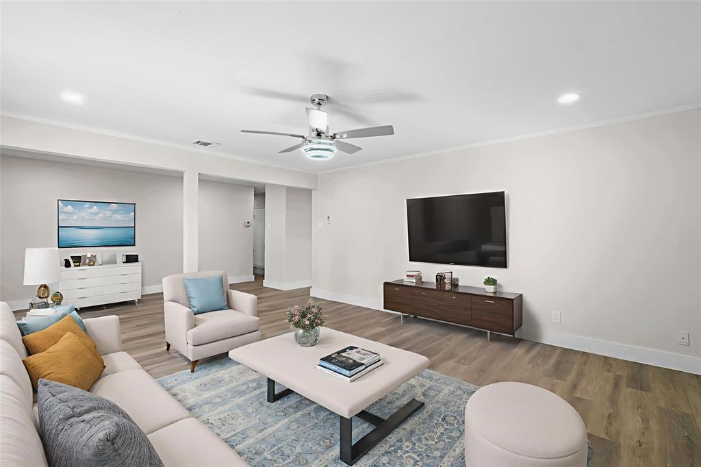 2008 East Peters Colony Road Carrollton, TX 75007 - Photo 10 of 35 a living room with furniture and a flat screen tv