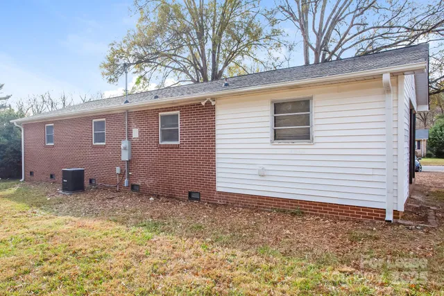 a view of a house with a yard and garage