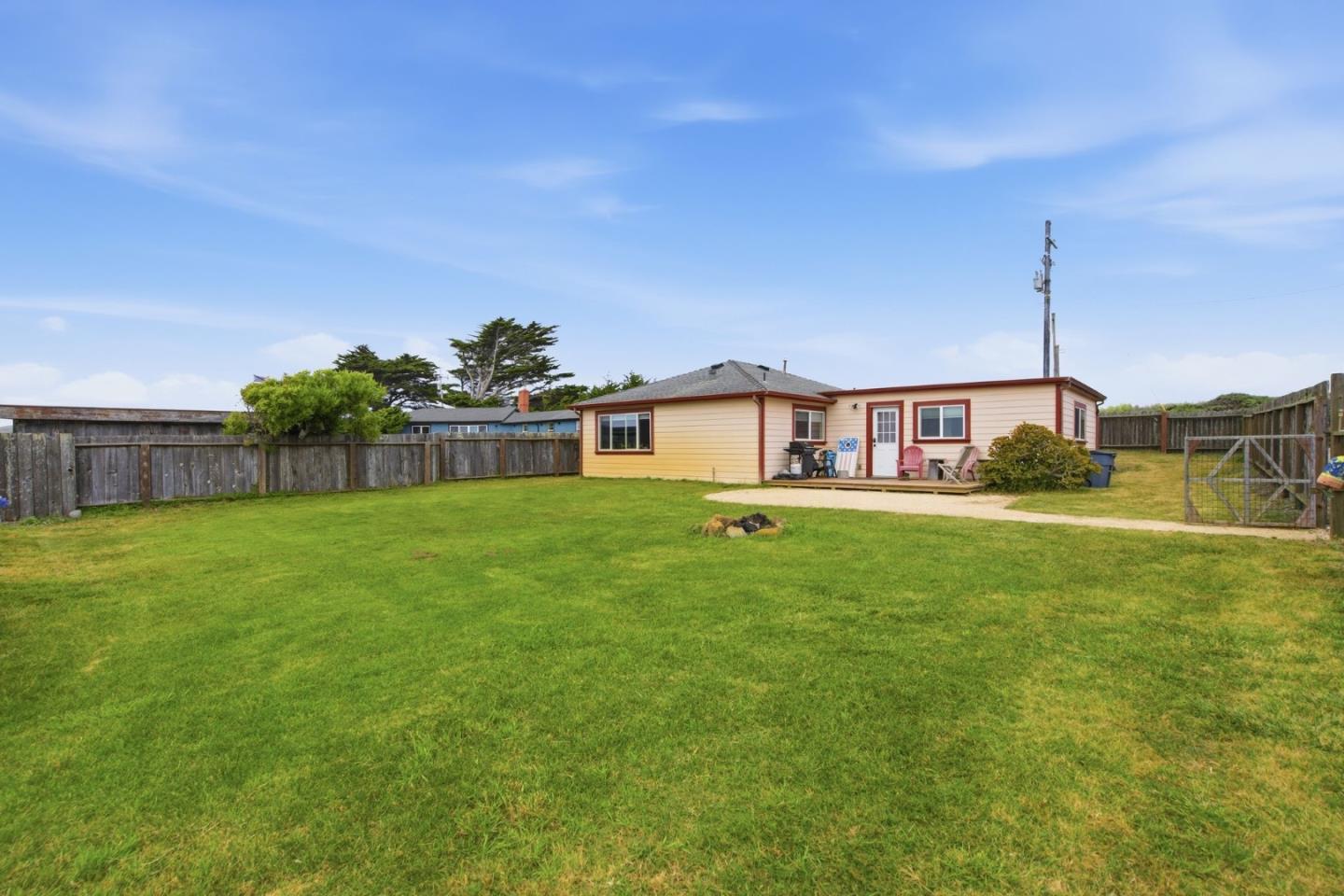 1263 Reservoir Road Pescadero, CA 94060 - Photo 44 of 66 a front view of a house with garden