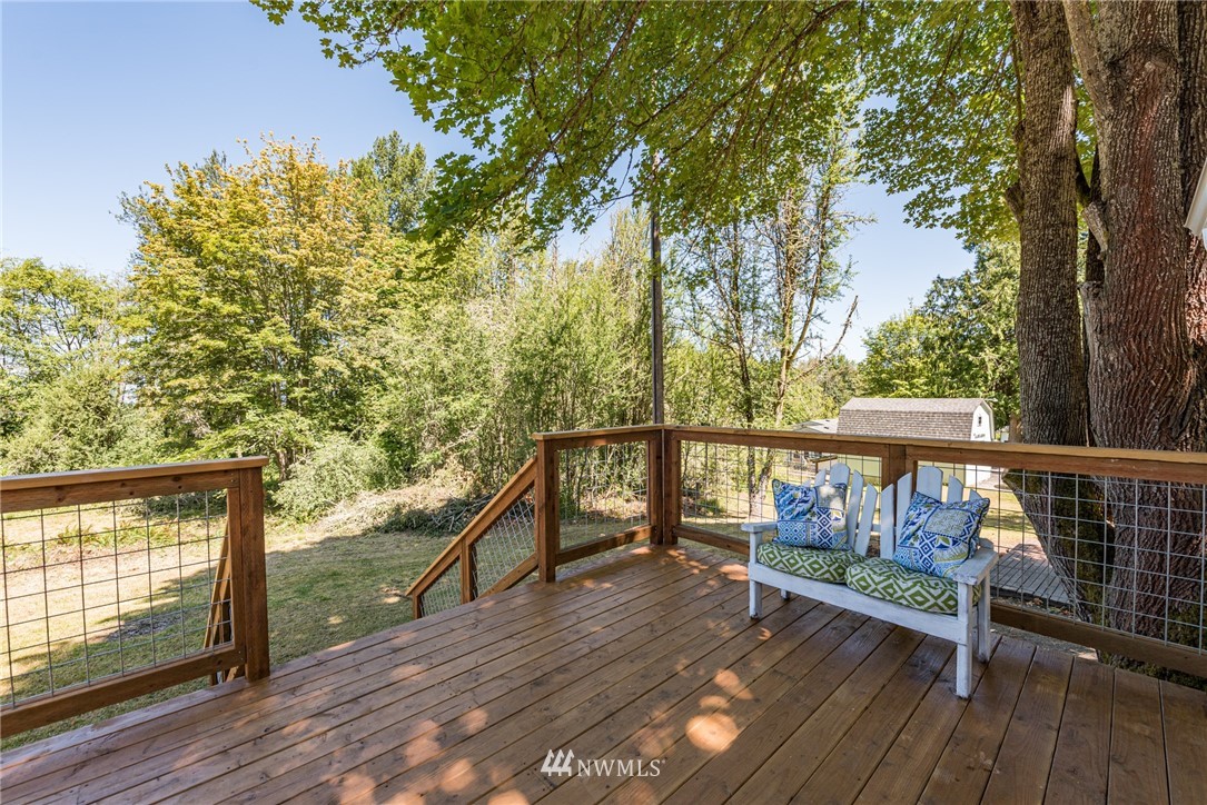 1391 Atterberry Road Sequim, WA 98382 - Photo 22 of 36 a view of deck with wooden floor and outdoor seating