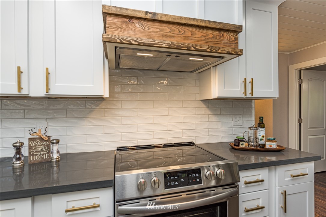 1391 Atterberry Road Sequim, WA 98382 - Photo 4 of 36 a stove top oven sitting inside of a kitchen