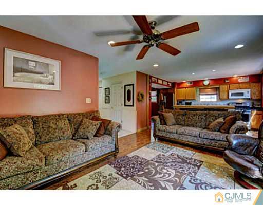 20 Kimberly Road Colonia, NJ 07067 - Photo 14 of 25 a living room with furniture and a ceiling fan
