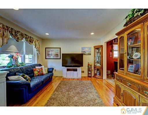 20 Kimberly Road Colonia, NJ 07067 - Photo 3 of 25 a living room with furniture and a flat screen tv