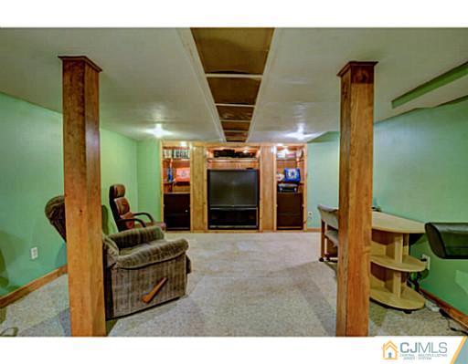 20 Kimberly Road Colonia, NJ 07067 - Photo 21 of 25 a living room with furniture and a walk in closet