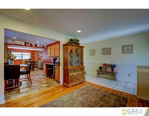 20 Kimberly Road Colonia, NJ 07067 - Photo 5 of 25 a living room with furniture and a flat screen tv