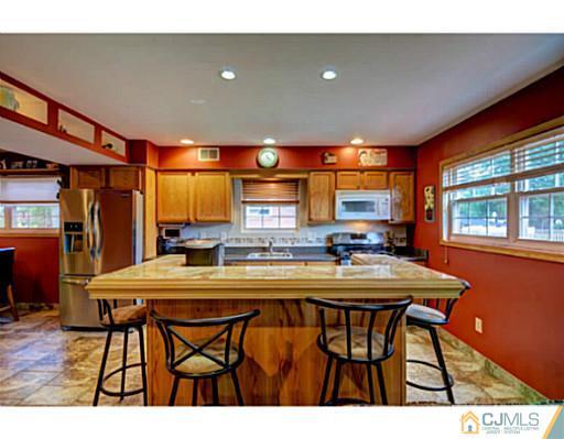 20 Kimberly Road Colonia, NJ 07067 - Photo 9 of 25 a kitchen with a table and chairs in it