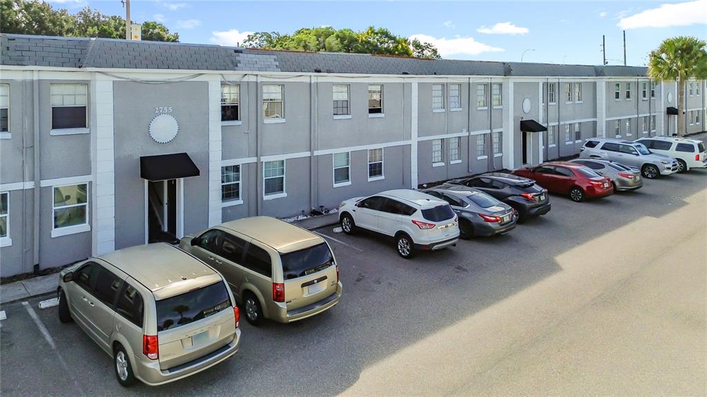 2753 L B McLeod Road, Unit D Orlando, FL 32805 - Photo 2 of 48 a couple of cars parked in front of a building