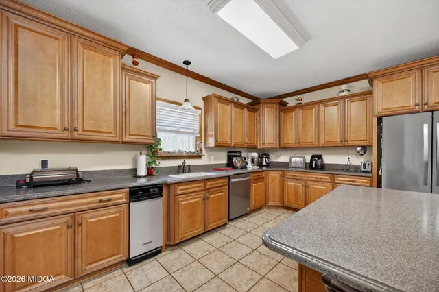 a living room with fireplace furniture and wooden floor