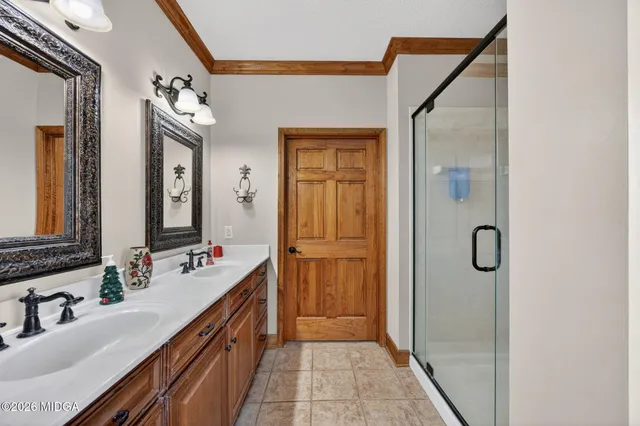 a bathroom with a tub and shower