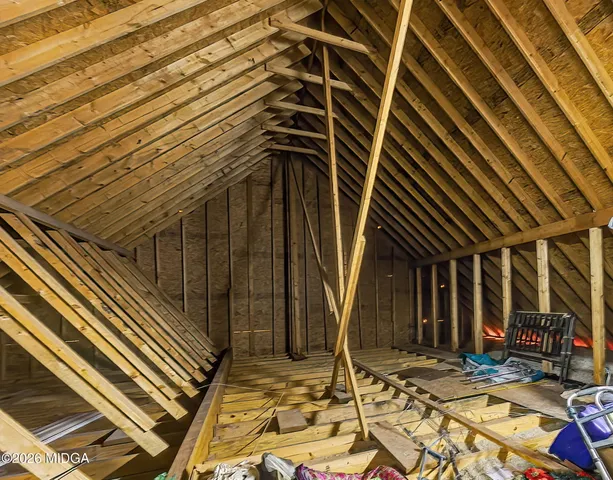 a view of a backyard with large trees