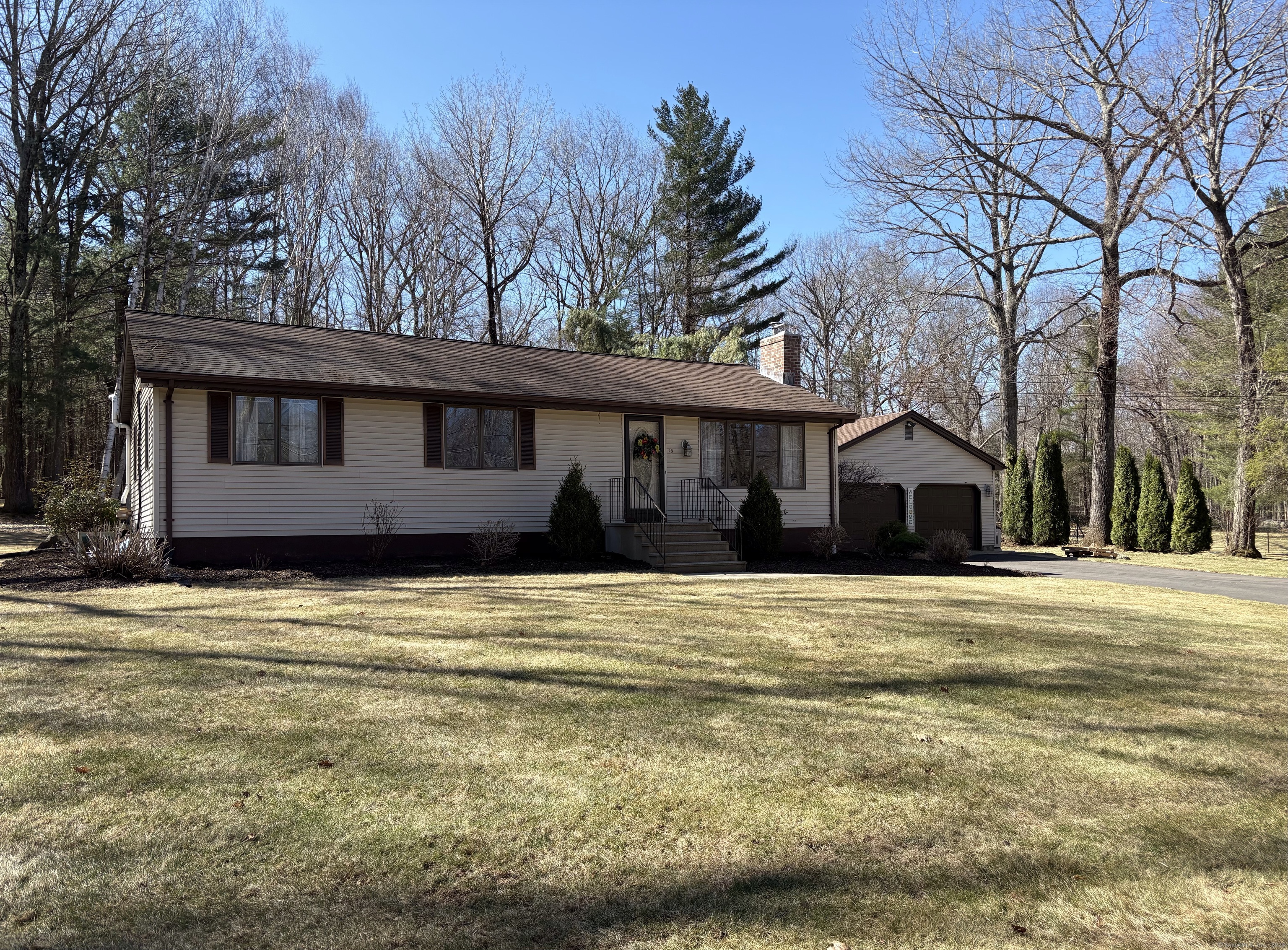 15 Webber Road Tolland, CT 06084 - Photo 1 of 1 a front view of a house with a garden