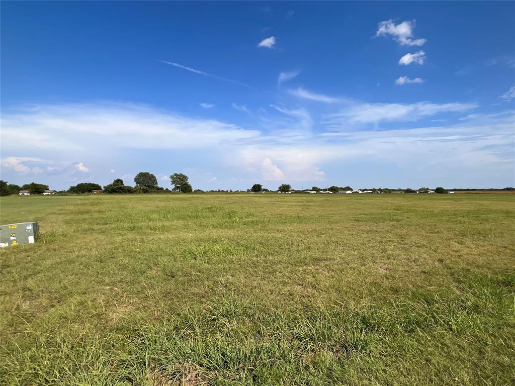 264 Sidewinder Loop Red Oak, TX 75154 - Photo 5 of 13 a view of a ocean with a building in the background